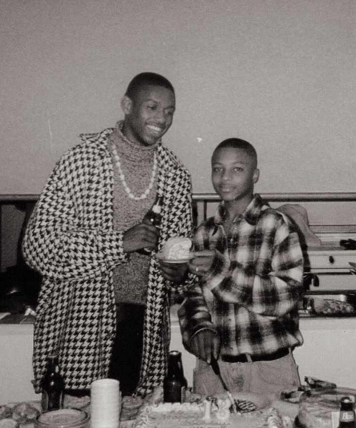 Wilson and his uncle Unildo at a birthday celebration, black-and-white photograph