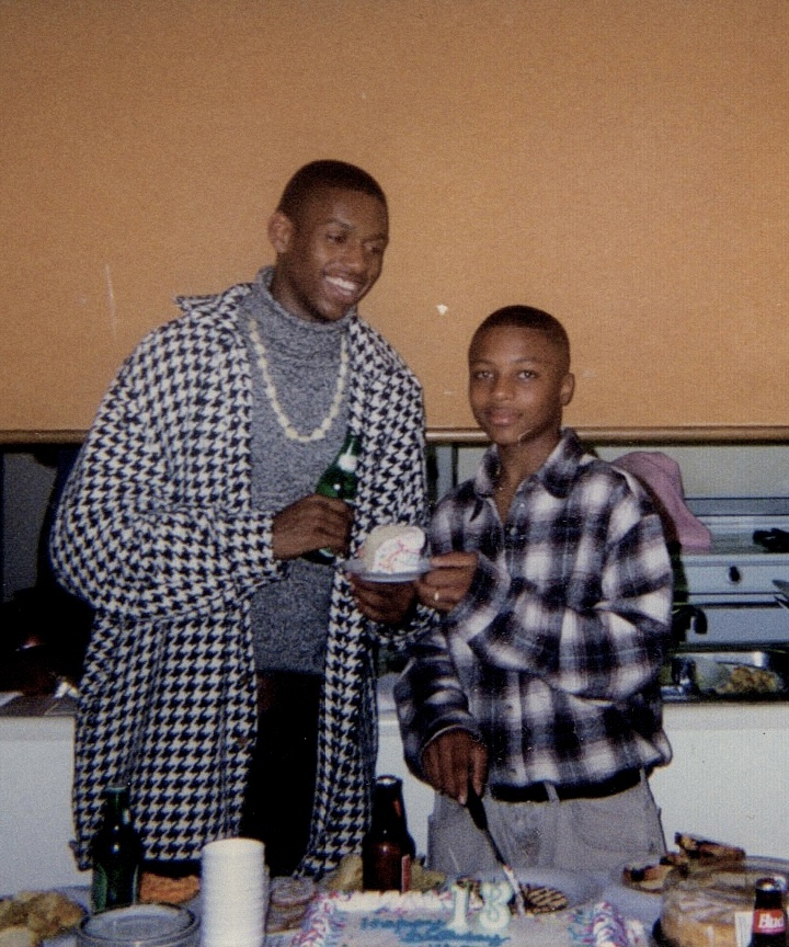 Wilson and his uncle Unildo at a birthday celebration, color photograph