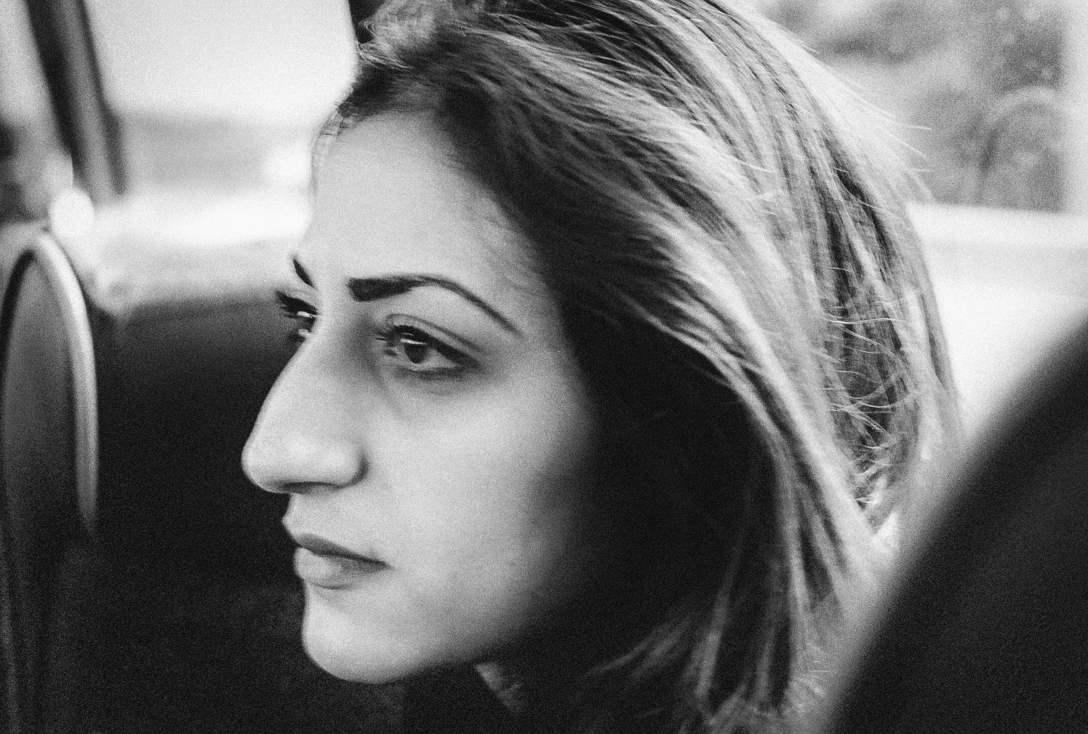 Last Shot of Cyprus - Black and white portrait of young woman in profile with flowing hair and contemplative expression
